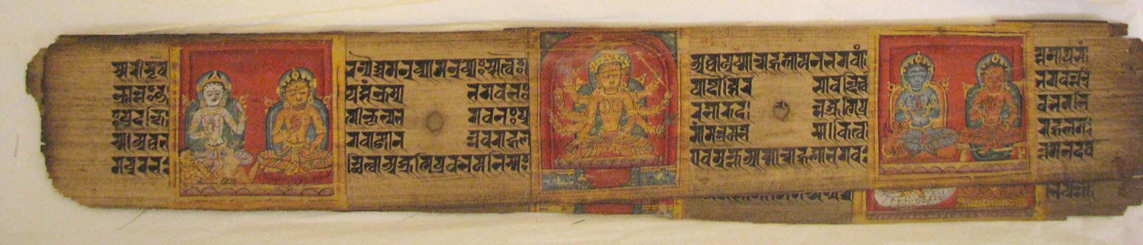 Long Buddhist manuscript leaf with three coloured miniatures and rows of script